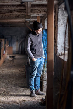 Man standing in stable