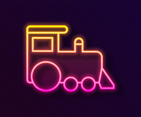 Glowing neon line Toy train icon isolated on black background. Vector.