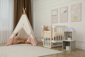 Fototapeta na wymiar Cute baby room interior with crib and play tent