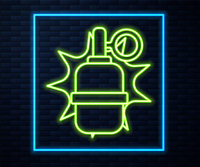Glowing neon line Hand grenade icon isolated on brick wall background. Bomb explosion. Vector.