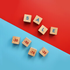 Wooden cubes with the inscription: sale and minus 20,30,50,70 percent. Seasonal sale, big discounts