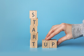 Wooden cubes with the inscription: start up. A new beginning, a new business