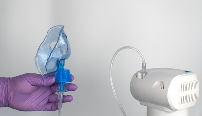 nebulizer that performs inhalation using the spray of a medicinal substance. it is used in the treatment of bronchial asthma and respiratory diseases. breathing mask for performing procedures.