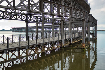 Fototapeta na wymiar Iron bridge over the ocean
