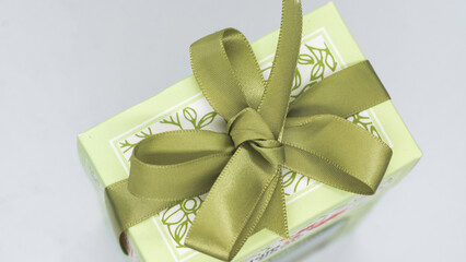 Green gift box with green bow for a fun holiday or birthday party