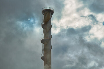 Tower expelling fumes in the fuel refining industry.