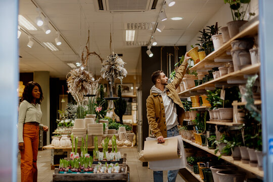 Young couple in flower shop