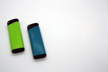 Two lighters on a white background.