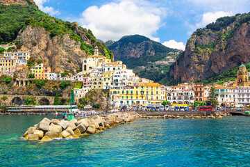 Panoramic view, aerial skyline of small haven of Amalfi village with tiny beach and colorful houses...
