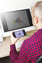 Obraz premium Businessman Using Technology To Analyze Results Of The Production