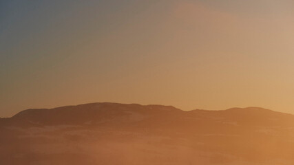 The middle part of the Totenåsen Hills to the north, Norway, in winter by sunset.