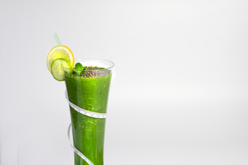 Healthy diet drink, a glass of diet drink on the scale, to lose weight,green smoothie
