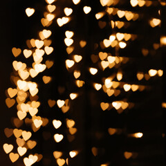 Gold background bokeh lights heart, valentine backgrounds, blurred sparkle for night backdrop....