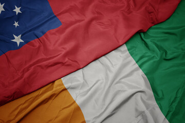 Fototapeta premium waving colorful flag of cote divoire and national flag of Samoa .