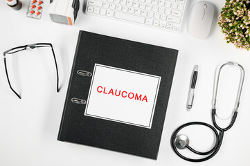 Doctor's workspace, in the center is a folder with the inscription: claucoma