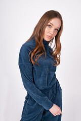 Young girl in a blue suit, on an isolated background