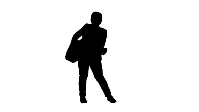 Silhouette Boy in white playing acoustic guitar and dancing.