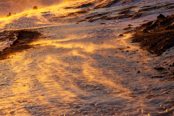Iceland. Reykjadalur steam valley near Reykjavik, in Iceland with hills covered in white during winter