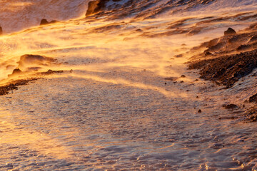 Iceland. Reykjadalur steam valley near Reykjavik, in Iceland with hills covered in white during winter