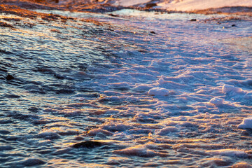 Iceland. Reykjadalur steam valley near Reykjavik, in Iceland with hills covered in white during winter