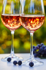 Two glasses with rose wine on the table, close up
