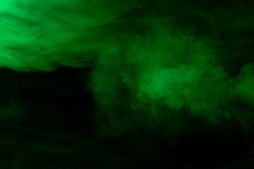 Green smoke on black background