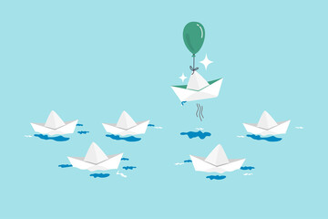 Think different, innovation to change from routine traditional thinking concept, stand out origami paper boat flying with air balloon in different path instead of follow others.