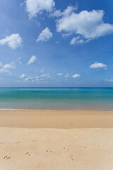 Fototapeta na wymiar Beautiful nature of the Andaman Sea and white sand beach in the morning at Patong Beach.