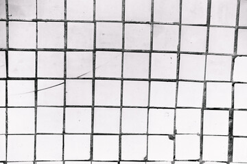 Sloppy white tiles with black seams. Minimalistic background.