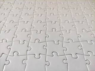 Fototapeta premium Close-up of blank white jigsaw puzzle texture background