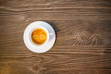 cup of coffee on wooden background