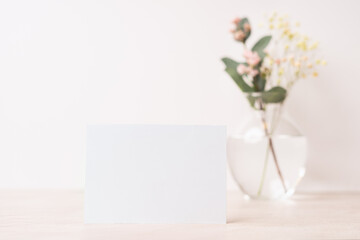 White blank letter greeting card, mockup on white background. Romantic love letter, invitation with flowers, copy space for text