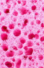 Pink sponge texture background. Close up, macro photo.
