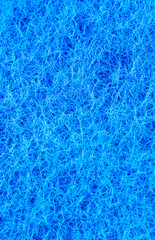 Blue sponge texture background. Close up, macro photo.