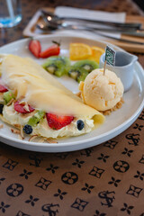 Cold crepes, vanilla ice cream with crepes and strawberry, sweet and desserts