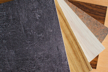 Several pieces of chipboard with the texture of stone and wood.