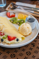 Cold crepes, vanilla ice cream with crepes and strawberry, sweet and desserts