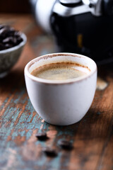  Cup of coffee on rustic wooden background. Close up.