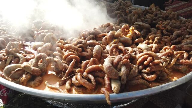 "Mumbar" stuffed or "bumbar" stuffed. Turkish dish made by filling the large intestines of sheep with a meaty internal mortar.