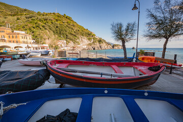 Fototapeta na wymiar Monterosso al Mare, Italy - October, 2020: boats wait for tourist at harbor. Monterosso al Mare, a coastal village and resort in Cinque Terre, Italy