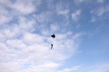 Skydiving. A parachute deployment. The finish of freefalling.
