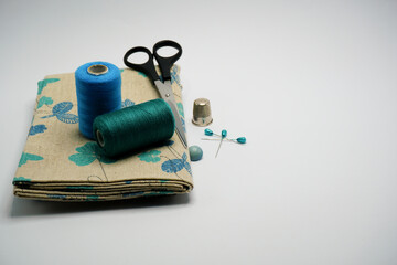 Fototapeta na wymiar Tailor sewing and dressmaking tools complements with bespoke pincushion designs