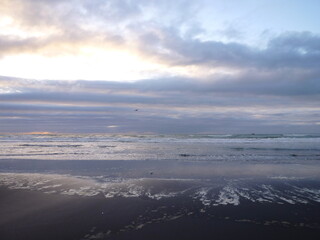 a cloudy sunset at the Mokau Beach, Waikato, North Island, New Zealand, November