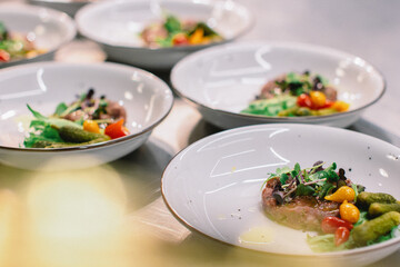 tartar with baked toast and egg served on a white plates