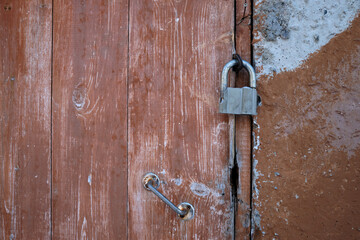 old metal lock on old wooden door