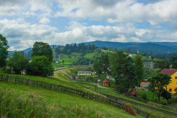 Mountains landscapes hiking trails wilderness forest fields and flowers farm car road haystacks Carpathians