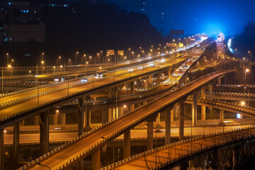 Fototapeta na wymiar At night,The intersecting multi-storey overpass in Chongqing, China