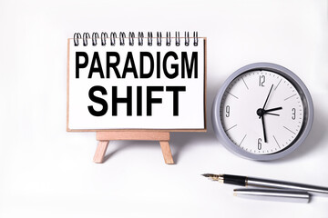 PARADIGM SHIFT, text on white paper on white background