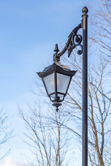 Vintage iron lantern in a public park in the daytime