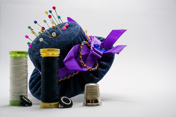 Fototapeta na wymiar Bespoke pincushion designs in the shape of hats for dressmaking and sewing craft